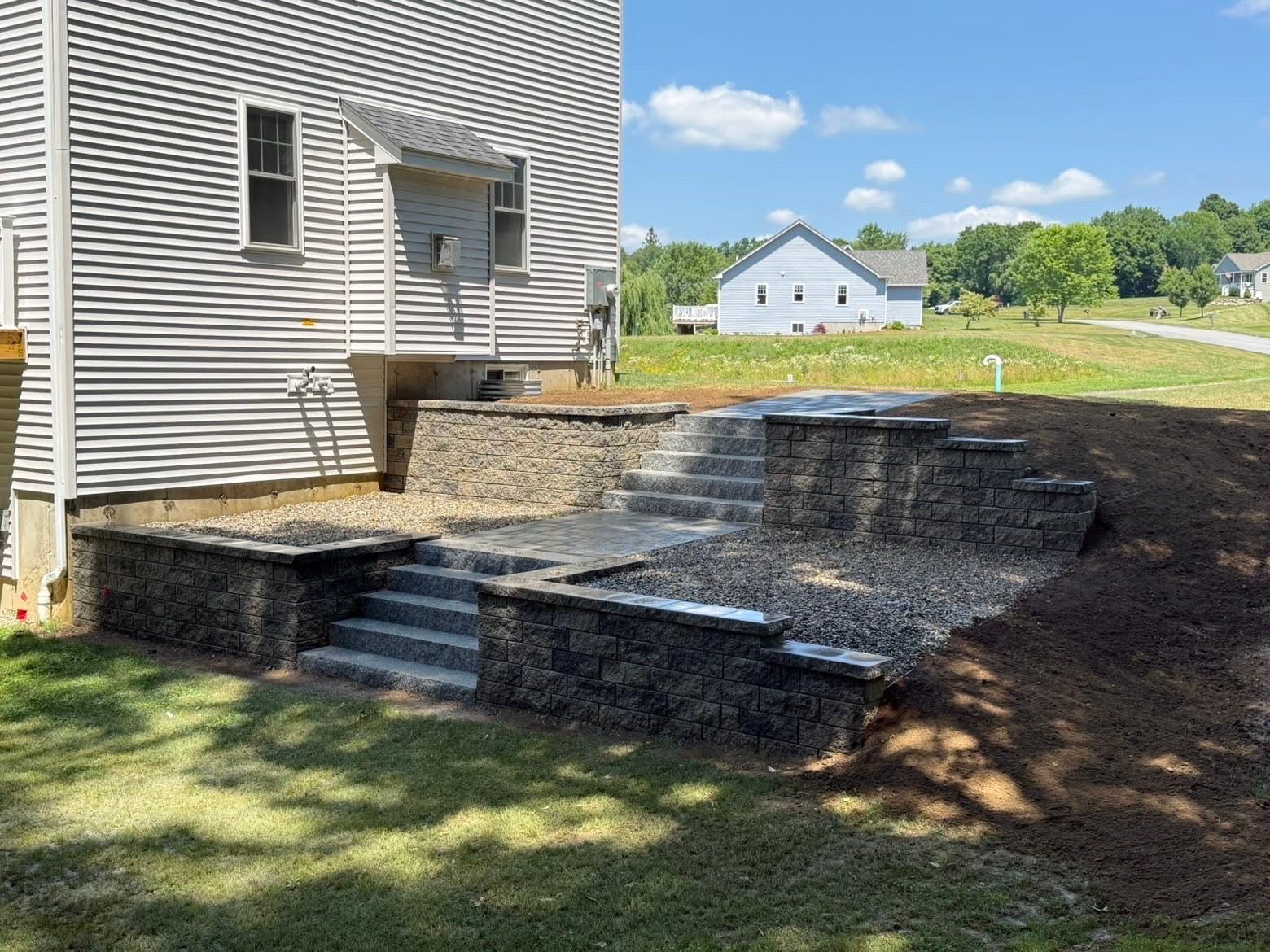 Retaining wall complete — slope fully stabilized